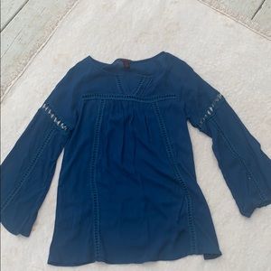 Blue top with stitch design.